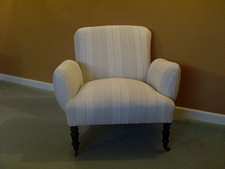 A Napoleon III low backed armchair