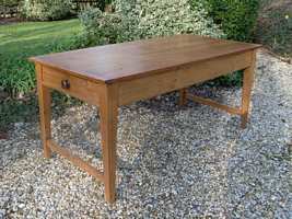 A pine kitchen table seats 8