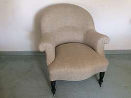 An unholstered French armchair