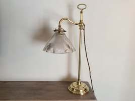 An adjustable brass lamp