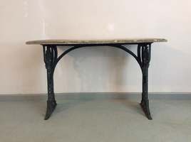 A cast iron & marble garden table