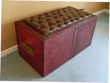 A 20thC red leather ottoman