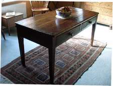 A 19thC painted pine kitchen table