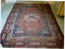 An antique caucasian rug