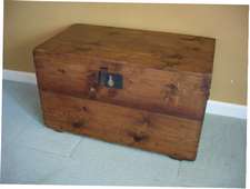 A 19thC pine travel trunk (coffee table)