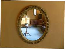 A grand early Victorian oval wall mirror
