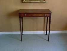 A Regency bow topped side table