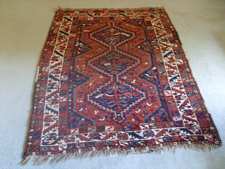 An antique caucasian rug