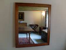 A Victorian pitch pine framed mirror