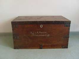 A 19thC teak and iron military trunk