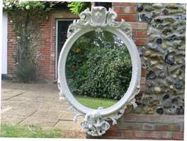 A large Victorian oval mirror