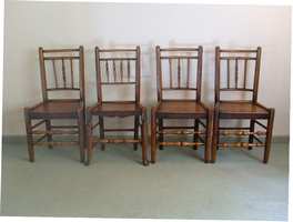 A harlequin set of antique spindle back chairs