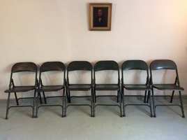 A set of mid century metal folding chairs