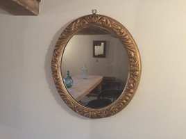 A 19thC oval gilded mirror