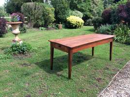 A 19thC french cherry wood dining table