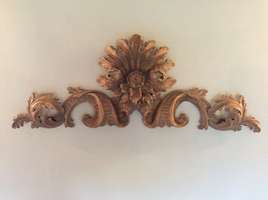 A carved limewood portico panel