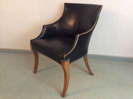 An Italian design leather arm chair