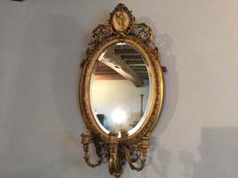 A French oval girondole mirror