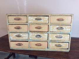 A painted bank of drawers