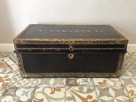 A Regency camphor and leather trunk