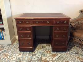 A nine drawer pedestal desk