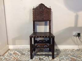 A 17thC Spanish walnut hall chair