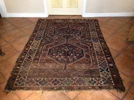 An antique Caucasian rug
