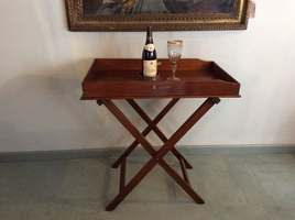 A 19thC mahogany butlers tray on stand