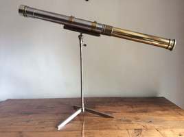 An Art Deco period telescope on stand