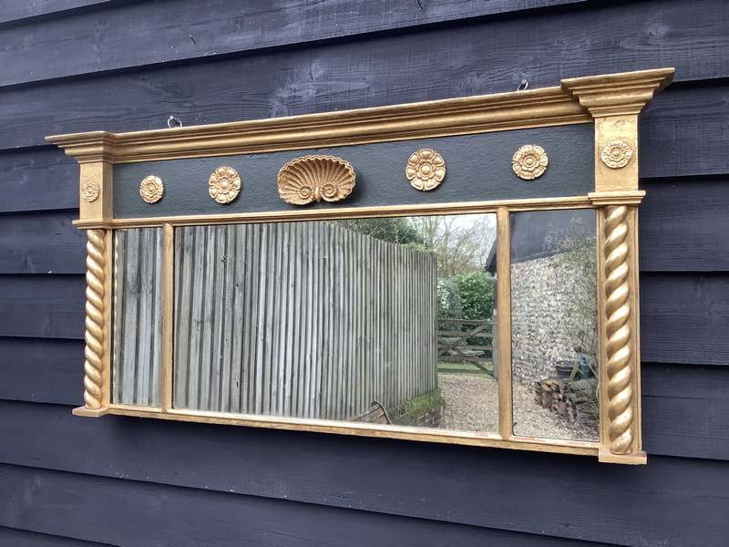 A rectangular gilded overmantle mirror