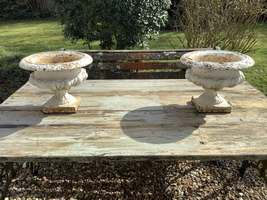 A pair of 19thC French cast iron table urns
