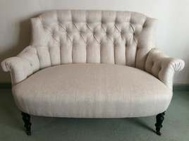 A small French buttoned sofa