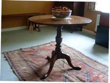A Geo III oak tripod table