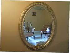 A large 19thC French oval hall mirror 