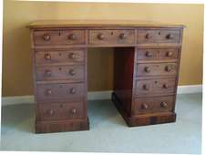A Victorian elven drawer desk